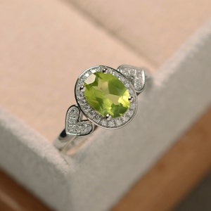 Oval cut peridot ring, sterling silver, halo ring