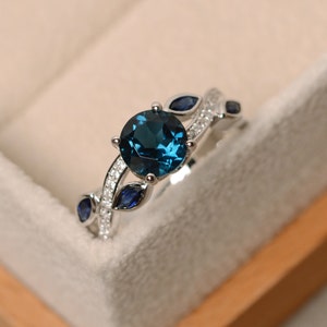 Genuine London blue topaz ring, leaf shaped, round cut, twist band ring, November birthstone