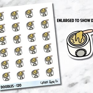 May include: Sheet of stickers featuring a white wax warmer with a yellow wax and a wooden applicator. The stickers are labeled "Doodles - 120" and "Enlarged to show detail". The stickers are from Cricket Paper Co.