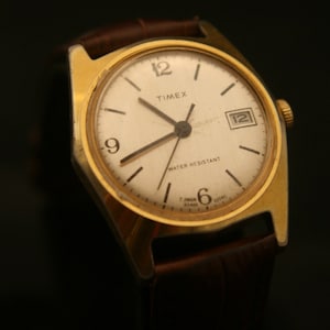 Vintage 1980 men's gold Timex Marlin brushed silver dial running