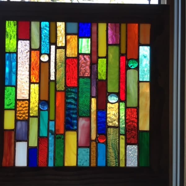 Hanging stained glass sun catcher in custom wooden frame