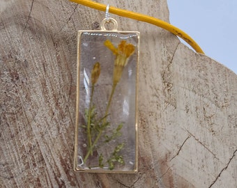 24 " Resin see through Necklace rectangle gold pendent with pressed dried yellow flower with leaves with yellow leather cord.