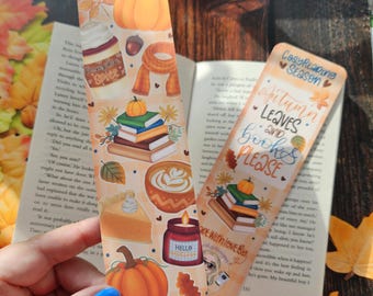 May include: Two fall-themed bookmarks with illustrations of pumpkins, books, and autumn treats. One bookmark reads "Autumn Leaves and Books Please." The other features a pumpkin spice latte and a scarf.
