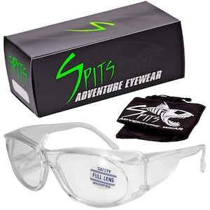 May include: Clear safety glasses with a full lens magnifier. The glasses are packaged in a black box with the brand name "SPITS ADVENTURE EYEWEAR" printed on it. The glasses also come with a black pouch with the brand name printed on it.