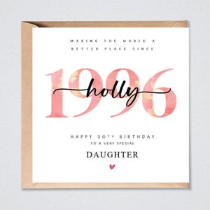 May include: A square greeting card with a kraft paper envelope. The card features the text "MAKING THE WORLD A BETTER PLACE SINCE 1996" in black, with the year 1996 in large pink watercolor font. It includes the name "holly" in black script, "HAPPY 30TH BIRTHDAY TO A VERY SPECIAL DAUGHTER" in black text, and a small pink heart.