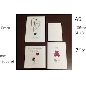 May include: Four blank greeting cards in different sizes, including A5 (5.8" x 8.3"), A6 (4.13" x 5.83"), and square (just under 6" square). The cards are white with a smooth finish. One card has the text "Fifty Five" written in black cursive.