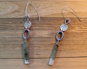 Green and white jade stones suspended under silver findings, attached to 925 sterling silver earwires