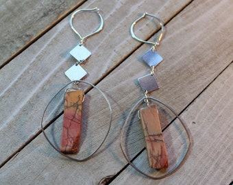 Red creek jasper stone suspended from silver squares, attached to 925 sterling silver lotus hoop earwire