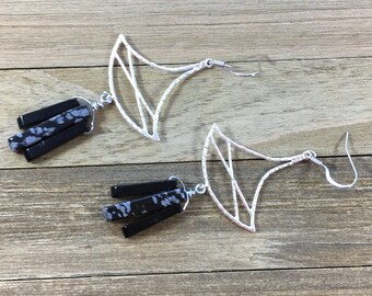 Delicate silver geometric shapes with suspended black onyx and snowflake obsidian stones on silver french hook