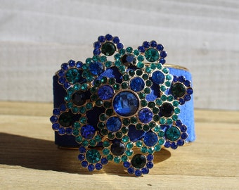 Brass, blue suede leather & flower rhinestone embellishment on an inlaid leather on gold metal cuff bracelet