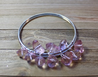 Silver double bangle bracelet with suspended dangly pink quartz stones