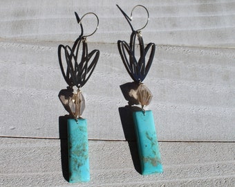 Mohave turquoise with czech glass suspended under silver lotus flowers and hanging from 925 sterling silver earwires