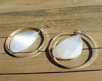 Chunky white selenite stones suspended inside large silver circles on 925 sterling silver ear wires