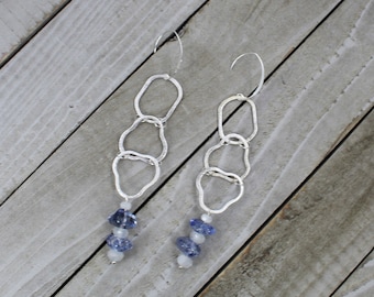 Tanzanite and rainbow moonstone stones with silver geometric shapes hanging from 925 sterling silver earwires