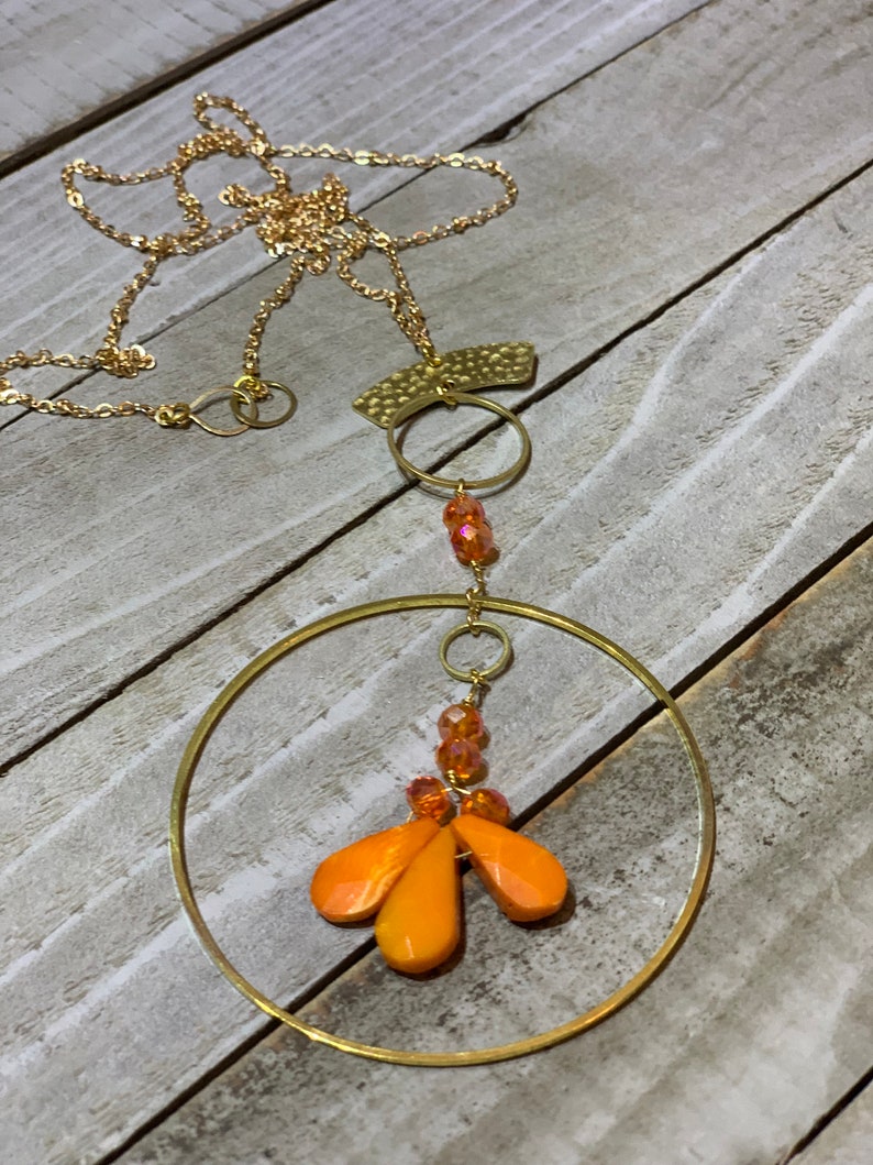 Faceted orange coral teardrops with czech glass beads hand wired to copper circle suspended on gold colored chain image 5