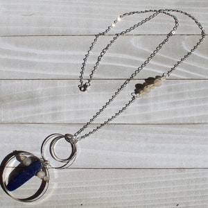 Lapis lazuli and rutile gold quartz floating inside silver circles with rutile quartz beads embedded in silver chain image 4