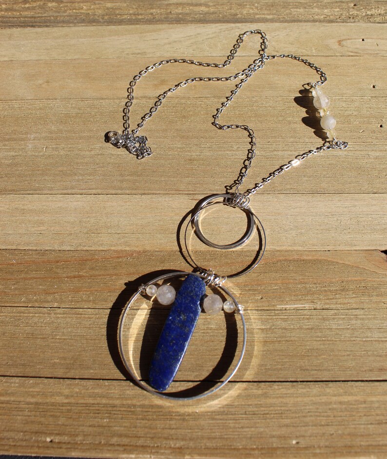 Lapis lazuli and rutile gold quartz floating inside silver circles with rutile quartz beads embedded in silver chain image 9