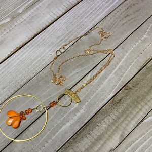 Faceted orange coral teardrops with czech glass beads hand wired to copper circle suspended on gold colored chain image 4