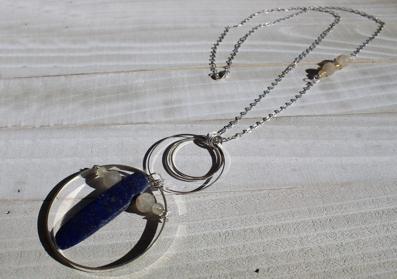 Lapis lazuli and rutile gold quartz floating inside silver circles with rutile quartz beads embedded in silver chain image 2