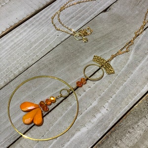 Faceted orange coral teardrops with czech glass beads hand wired to copper circle suspended on gold colored chain image 9