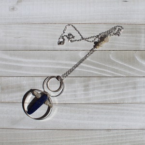 Lapis lazuli and rutile gold quartz floating inside silver circles with rutile quartz beads embedded in silver chain image 6