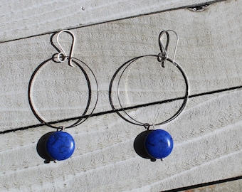 Dyed blue magnesite stone coin, suspended from skinny silver circle and hung from silver 925 sterling silver french hooks