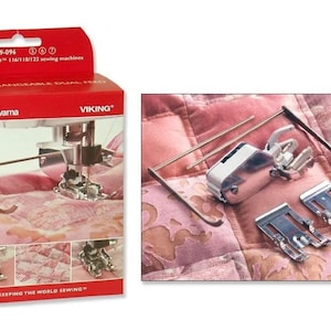 May include: A red and white Husqvarna Viking box with an interchangeable dual feed sewing machine foot. The box shows the foot in use and includes the text "KEEPING THE WORLD SEWING". Additional sewing machine feet are also shown.