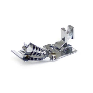 May include: A shiny, chrome-colored sewing machine foot. The foot has a spring mechanism and a flat base with a screw. It is designed to attach to a sewing machine and guide fabric during stitching.