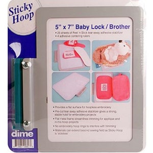 May include: A grey and blue package for the Sticky Hoop embroidery system. The package includes a 12.7cm x 17.8cm Baby Lock/Brother frame, adhesive stabilizer sheets, and centering rulers. The package shows examples of embroidery projects.