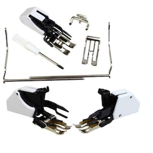 May include: A sewing machine presser foot kit with various attachments. The kit includes multiple presser feet, a screwdriver, and other small metal components. The presser feet have a white and black design with silver metal parts.