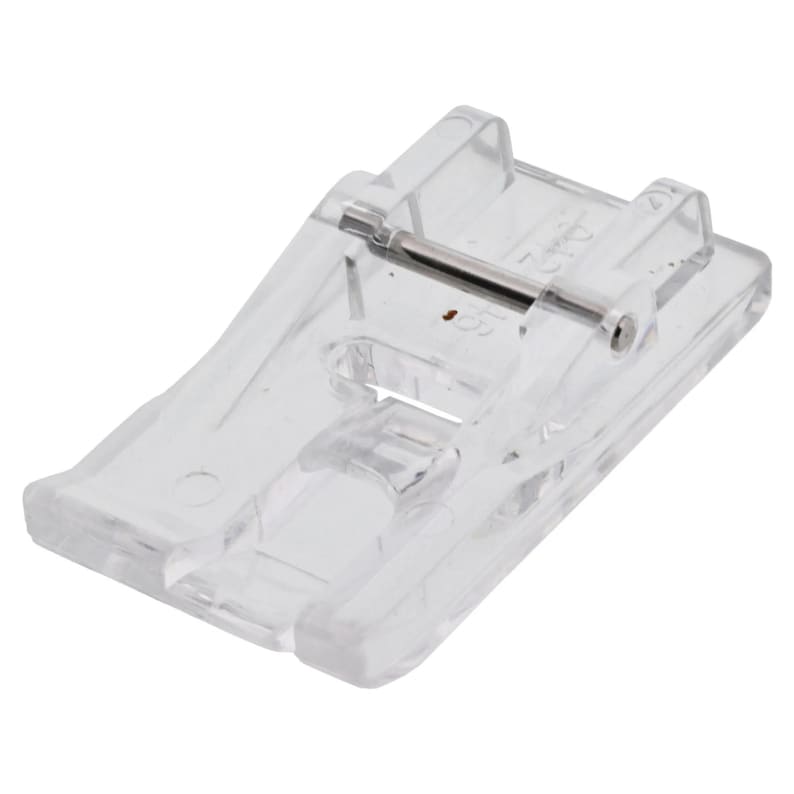 May include: A clear, transparent sewing machine foot with a metal bar. The foot is rectangular with rounded edges and is designed to attach to a sewing machine. It is made of clear plastic.