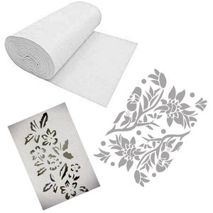 May include: A roll of white fabric and two floral stencils. One stencil is a cut-out design of flowers and leaves. The other stencil is a gray floral pattern. The fabric is unrolled, showing a flat surface.