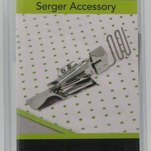 May include: A Baby Lock serger accessory for knit and woven fabrics. The package includes a double fold bias binder, 15mm. The package has the text "Serger Accessory" and "Baby Lock".
