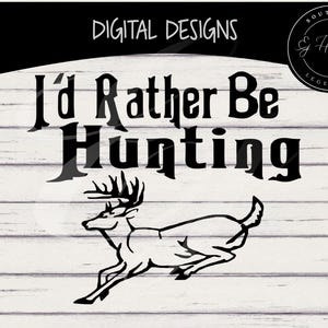 May include: Black and white digital design with the text "I'd Rather Be Hunting" above a running deer silhouette. The design is set against a white wood-grain background, with "Digital Designs" at the top.