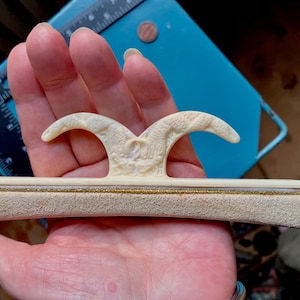 May include: A set of three ceramic mugs with a speckled, matte finish in cream, light grey, and dark grey. Each mug has a simple, minimalist design and a rounded handle.