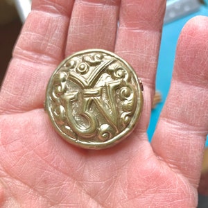 May include: A handmade wooden sign with the text "Welcome" in a playful font. The sign is painted white with a distressed finish, and features a decorative floral design. It measures approximately 12 inches wide and 6 inches tall.