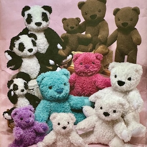 May include: A collection of plush teddy bears and panda bears in various colors, including brown, white, black, purple, pink, and teal. The image is a pattern for making stuffed animals. The Simplicity logo is visible.