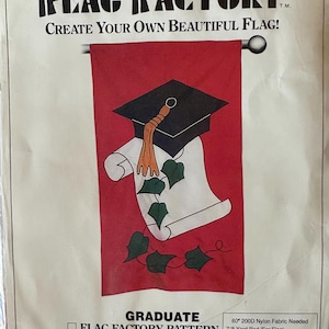 May include: A red flag pattern with a graduation theme. The design features a black graduation cap, a scroll, and green ivy. The text reads "The Flag Factory" and "Create Your Own Beautiful Flag!" The flag is designed to finish at 28" x 49".