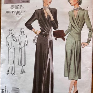 May include: A vintage Vogue sewing pattern from 1947, featuring illustrations of two long dresses. One dress is black, the other is olive green. The cover includes the text "Vogue Vintage Model" and "Original 1947 Design".