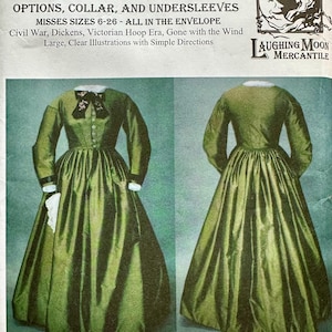 May include: A vintage sewing pattern for an early 1860s day dress. The pattern includes options for sleeves, collars, and undersleeves. The dress is shown in a dark green fabric with a full skirt and long sleeves. The pattern is from Laughing Moon Mercantile.
