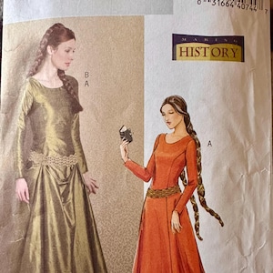 May include: Butterick B4827 sewing pattern featuring medieval-style dresses. The pattern includes illustrations of two women in long gowns, one in olive green and the other in orange. The text "MAKING HISTORY" is also visible.