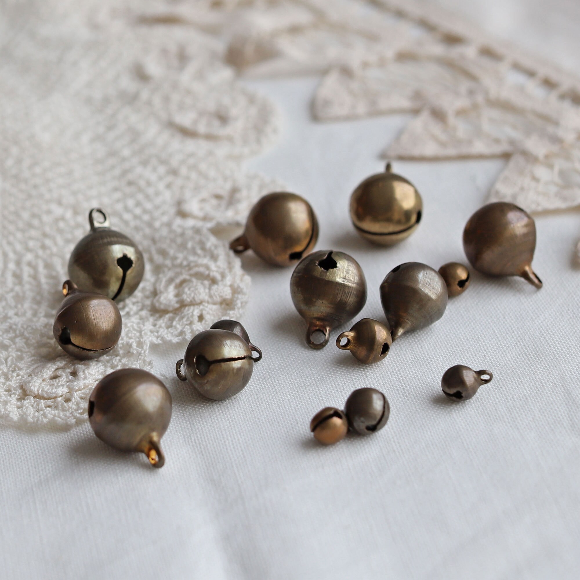 thumbnail image 2 of 100 Antique Brass Jingle Bells – 25mm (1 Inch) – For Crafts, Primitive, Steampunk 2 of 6