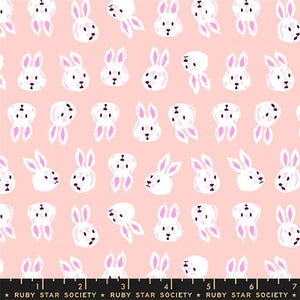 May include: A repeating pattern of white bunny faces and ears with pink accents on a light pink background. The bunnies have black eyes and noses. The text "RUBY STAR SOCIETY" is at the bottom.