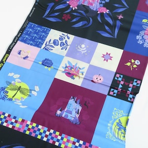 May include: A patterned fabric panel with a patchwork design. Each square features a different illustration, such as castles, flowers, dragonflies, and stars. The colour scheme includes blue, purple, pink, and black.