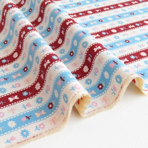 May include: White fabric with red, blue, and pink stripes. The stripes are decorated with a repeating pattern of flowers, butterflies, and leaves. The fabric has a slightly textured surface.