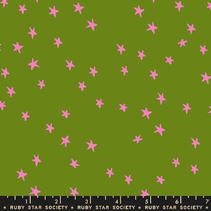 May include: Green fabric featuring a random arrangement of pink stars. The stars have a hand-drawn aesthetic. Ideal for sewing, quilting, or various craft projects. The fabric is suitable for making clothes.