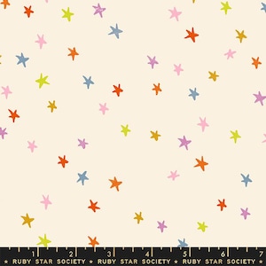 May include: A white fabric with a repeating pattern of colourful stars. The stars are in various shades of orange, yellow, pink, purple, and blue. The fabric is perfect for quilting, sewing, and crafting.