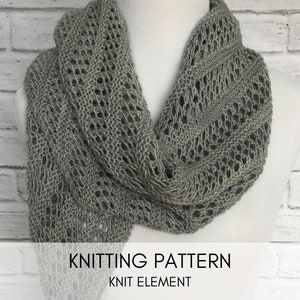 May include: A grey knitted scarf with a lacy pattern. The scarf is draped over a white surface and a brick wall is visible in the background. The text "Knitting Pattern" and "Knit Element" is visible at the bottom of the image.