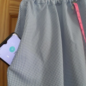 Midcalf length cotton blend light blue flared summer skirt with elastic waist and white lace bottom trim