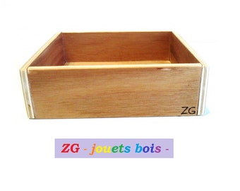 May include: A wooden box with a light brown finish. The box has a simple design and is made of plywood. The box has the text "ZG" engraved on the bottom.